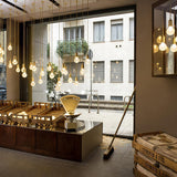 Luxury Clear Crystal Glass LED Pendant Lamp with Brass Fixture for Indoor Decor