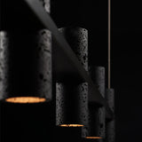 Meta Parallel Modern Linear LED Pendant Light with Natural Black Stone and Copper Accents