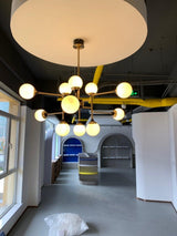 Mid Century Modern Brass Chandelier with Blown White Glass Globes and Bent Arms