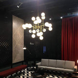 Mid Century Modern Brass Chandelier with Blown White Glass Globes and Bent Arms