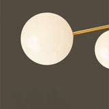 Mid Century Modern Brass Crown Chandelier with White Glass Globe Shades for Indoor Lighting