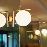 Mid Century Modern Opal Glass Globe Wall Sconce Lamp in Black and Gold