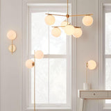 Mid Century Modern Sphere and Stem Chandelier with White Glass Globes and Brass Finish