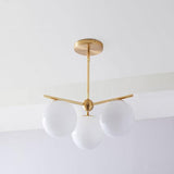 Mid Century Modern Sphere and Stem Chandelier with White Glass Globes and Brass Finish