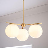 Mid Century Modern Sphere and Stem Chandelier with White Glass Globes and Brass Finish