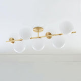Mid Century Modern Sphere and Stem Chandelier with White Glass Globes and Brass Finish
