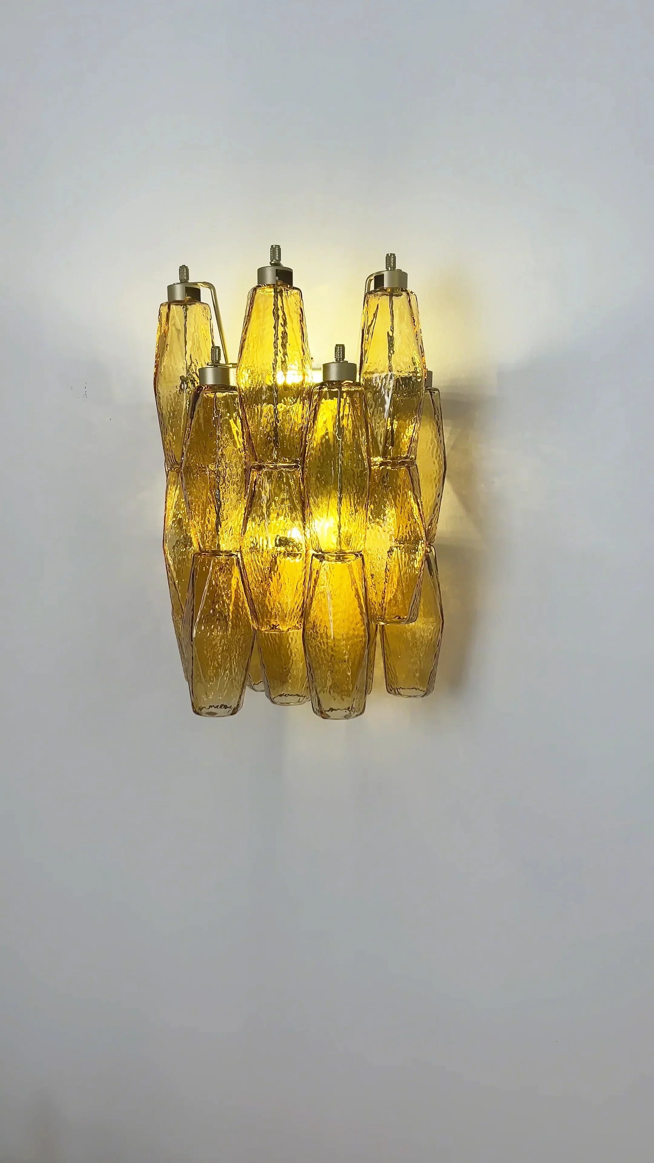 modern-amber-murano-glass-poliedri-sconce-pair-with-brass-finish-for-luxury-interiors