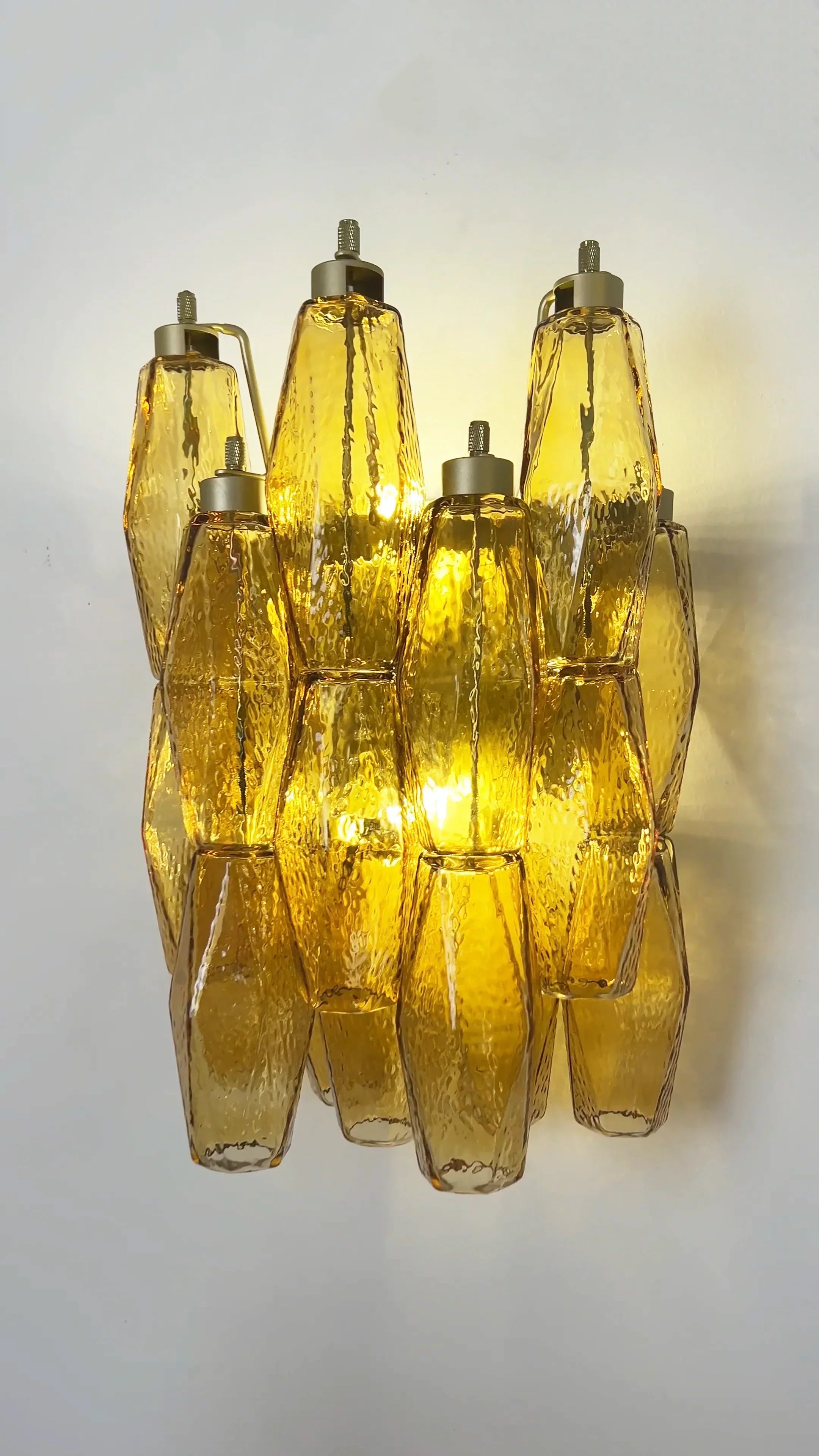 modern-amber-murano-glass-poliedri-sconce-pair-with-brass-finish-for-luxury-interiors