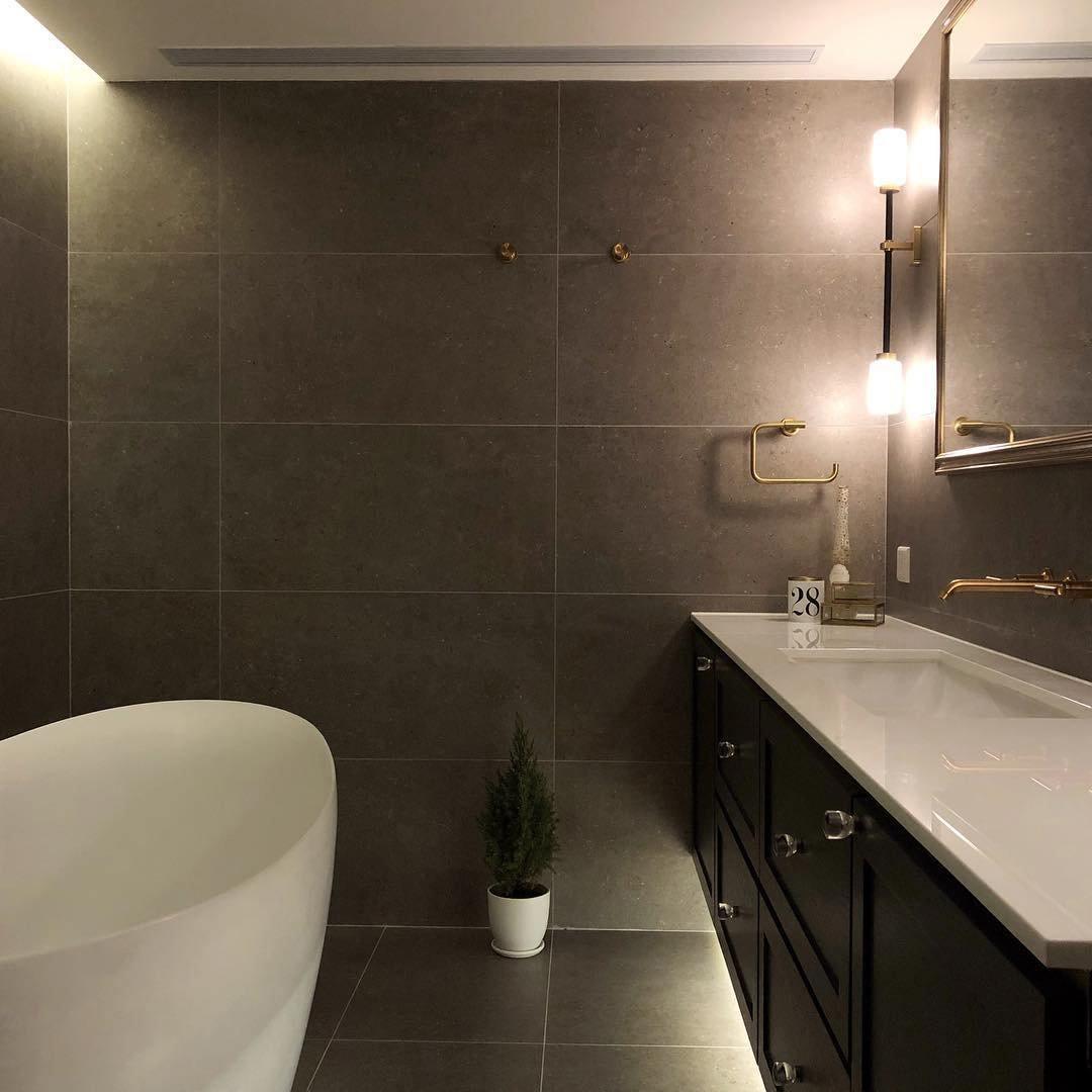 Modern Asymmetric Brass Wall Sconce with Cylindrical Glass Shades for Luxury Interiors