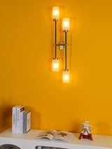 Modern Asymmetric Brass Wall Sconce with Cylindrical Glass Shades for Luxury Interiors