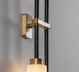 Modern Asymmetric Brass Wall Sconce with Cylindrical Glass Shades for Luxury Interiors