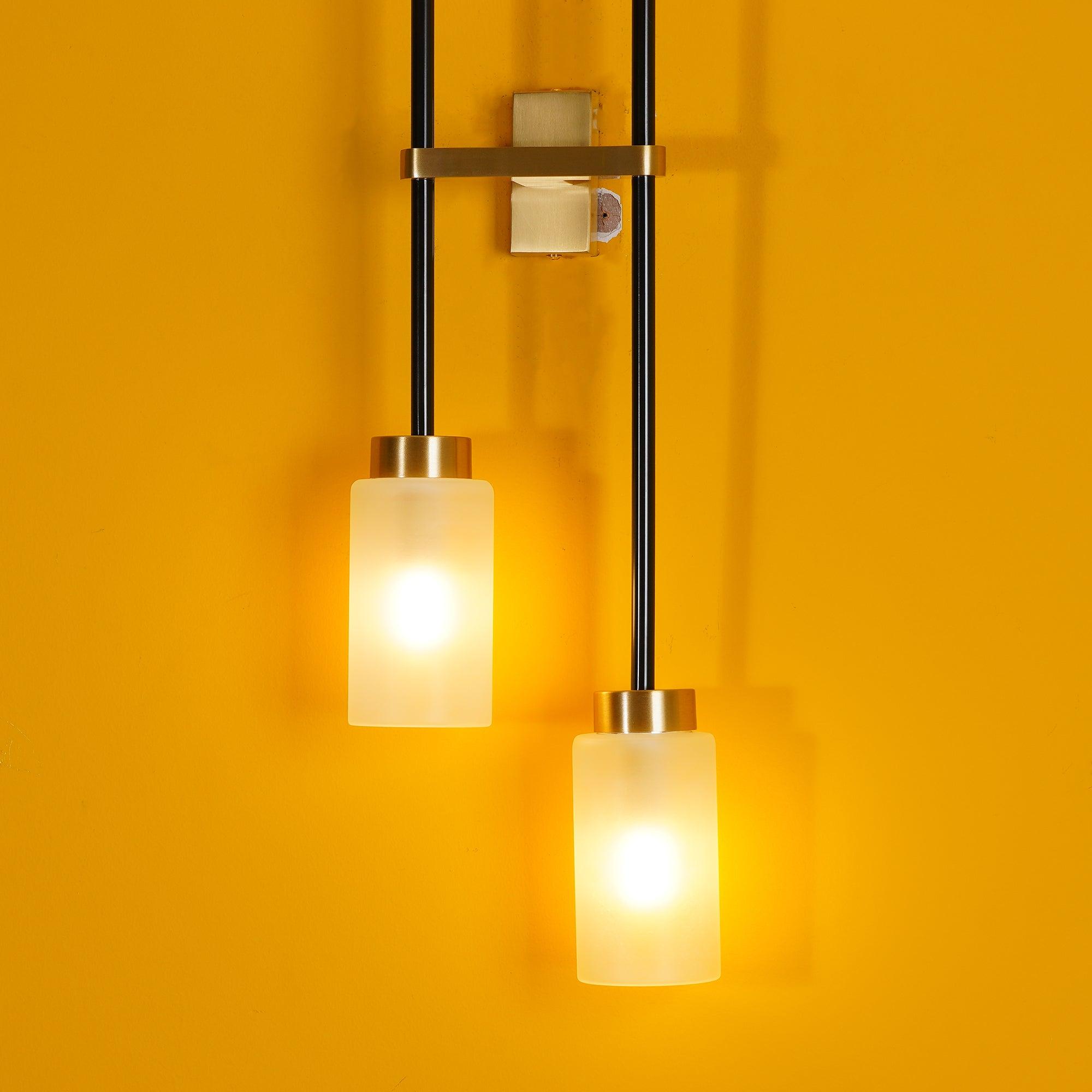 Modern Asymmetric Brass Wall Sconce with Cylindrical Glass Shades for Luxury Interiors