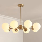 modern-asymmetrical-brass-chandelier-with-opal-glass-globe-shades-for-living-and-dining-rooms