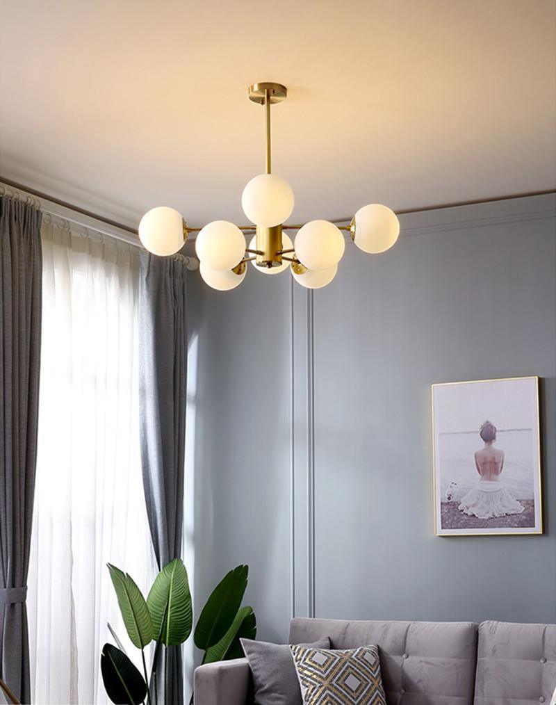 modern-asymmetrical-brass-chandelier-with-opal-glass-globe-shades-for-living-and-dining-rooms