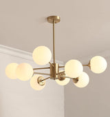 modern-asymmetrical-brass-chandelier-with-opal-glass-globe-shades-for-living-and-dining-rooms