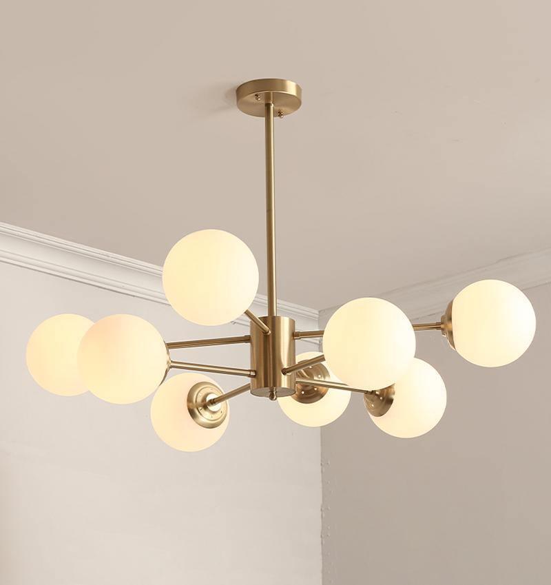 modern-asymmetrical-brass-chandelier-with-opal-glass-globe-shades-for-living-and-dining-rooms