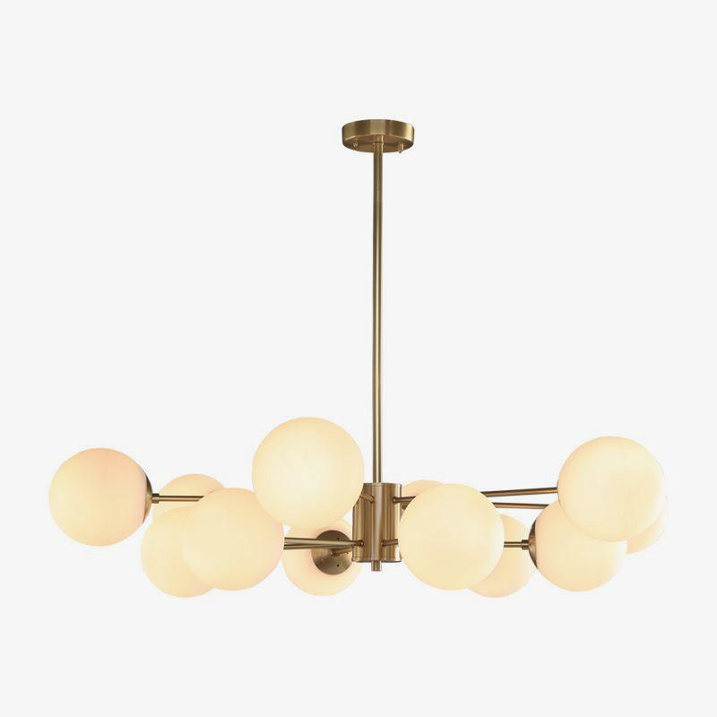 modern-asymmetrical-brass-chandelier-with-opal-glass-globe-shades-for-living-and-dining-rooms