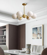 modern-asymmetrical-brass-chandelier-with-opal-glass-globe-shades-for-living-and-dining-rooms