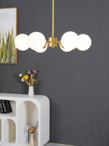 modern-asymmetrical-brass-chandelier-with-opal-glass-globe-shades-for-living-and-dining-rooms