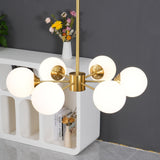 modern-asymmetrical-brass-chandelier-with-opal-glass-globe-shades-for-living-and-dining-rooms