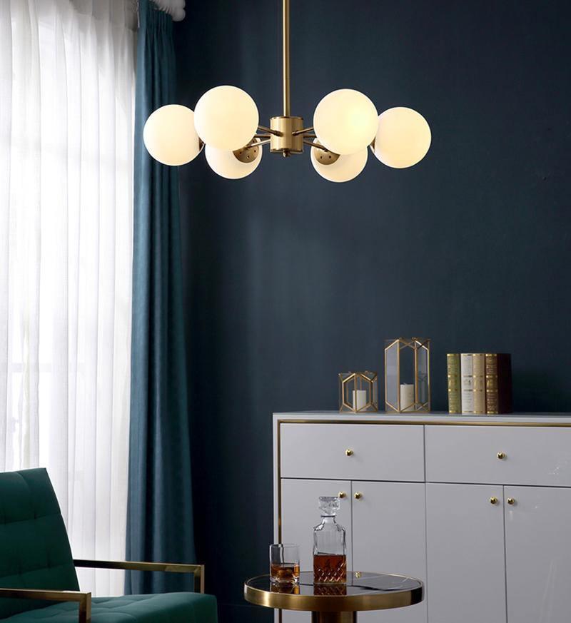 modern-asymmetrical-brass-chandelier-with-opal-glass-globe-shades-for-living-and-dining-rooms