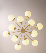 modern-asymmetrical-brass-chandelier-with-opal-glass-globe-shades-for-living-and-dining-rooms