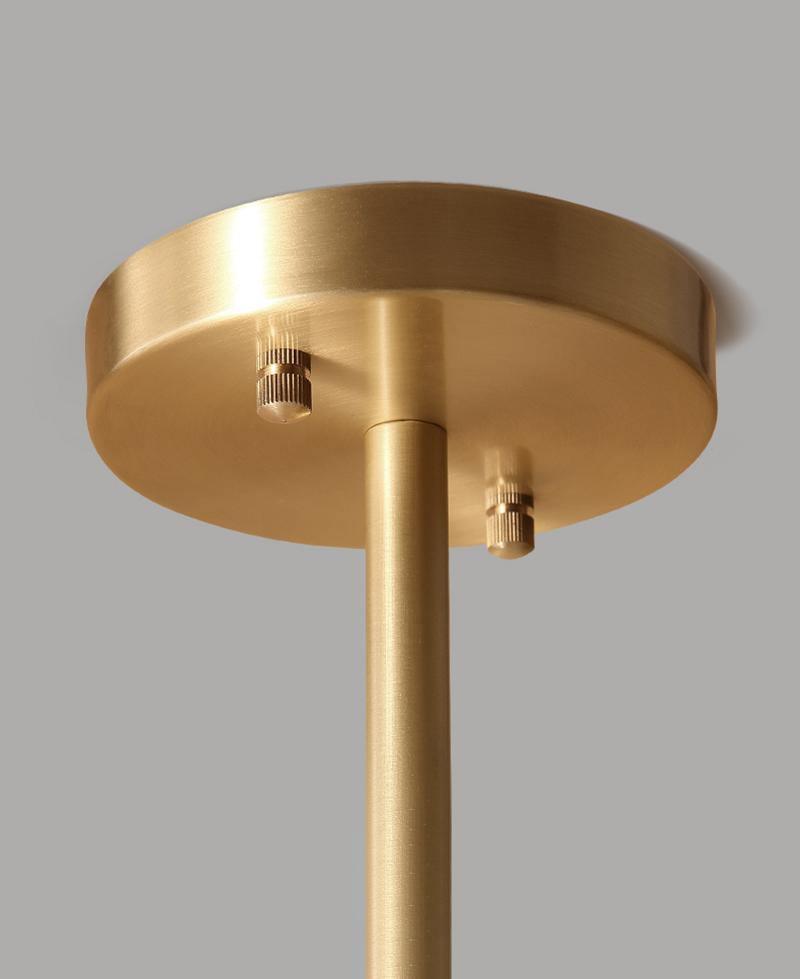 modern-asymmetrical-brass-chandelier-with-opal-glass-globe-shades-for-living-and-dining-rooms