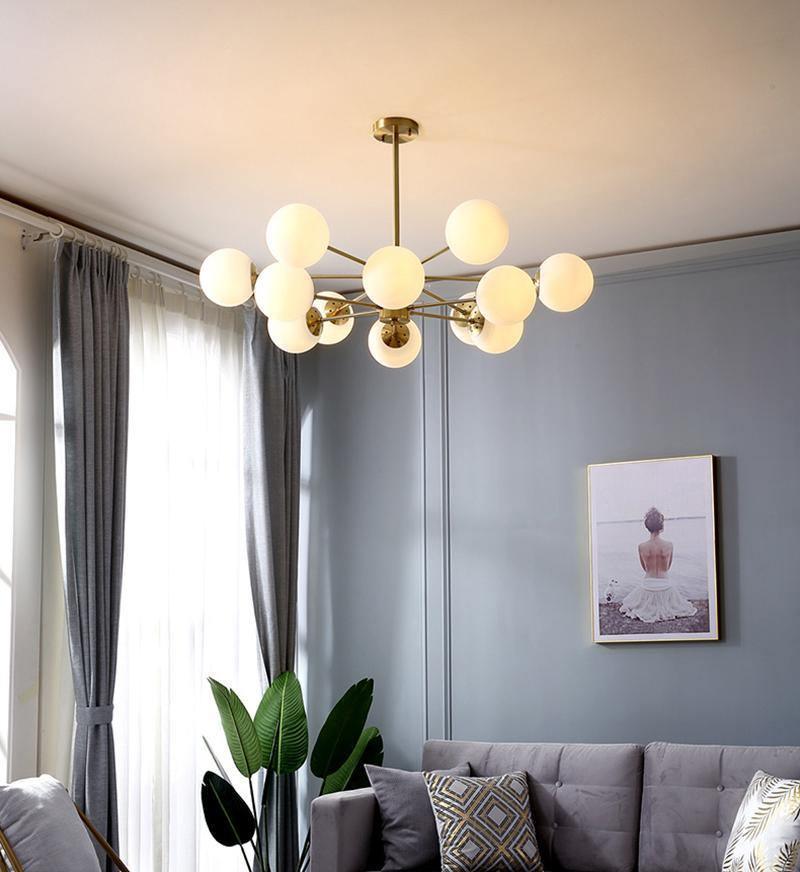 modern-asymmetrical-brass-chandelier-with-opal-glass-globe-shades-for-living-and-dining-rooms