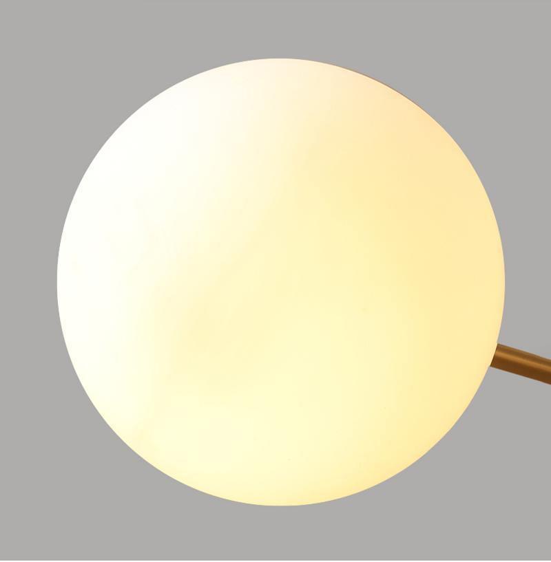modern-asymmetrical-brass-chandelier-with-opal-glass-globe-shades-for-living-and-dining-rooms
