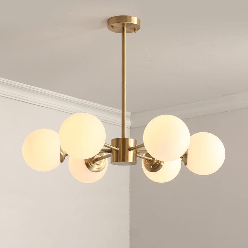 modern-asymmetrical-brass-chandelier-with-opal-glass-globe-shades-for-living-and-dining-rooms