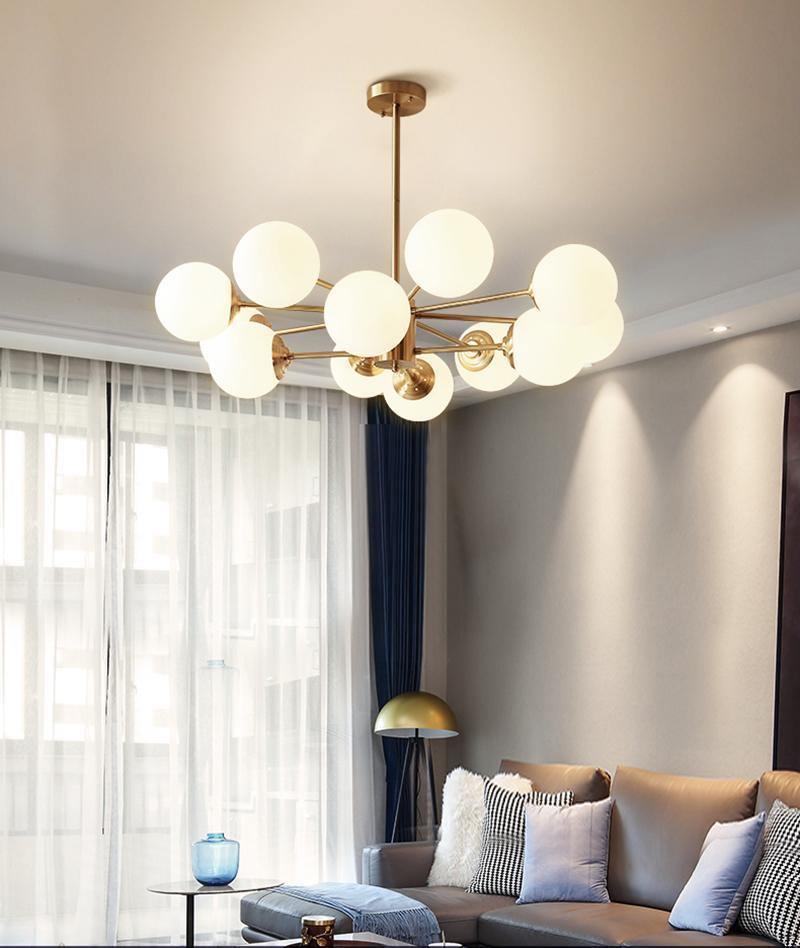 modern-asymmetrical-brass-chandelier-with-opal-glass-globe-shades-for-living-and-dining-rooms