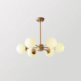 modern-asymmetrical-brass-chandelier-with-opal-glass-globe-shades-for-living-and-dining-rooms