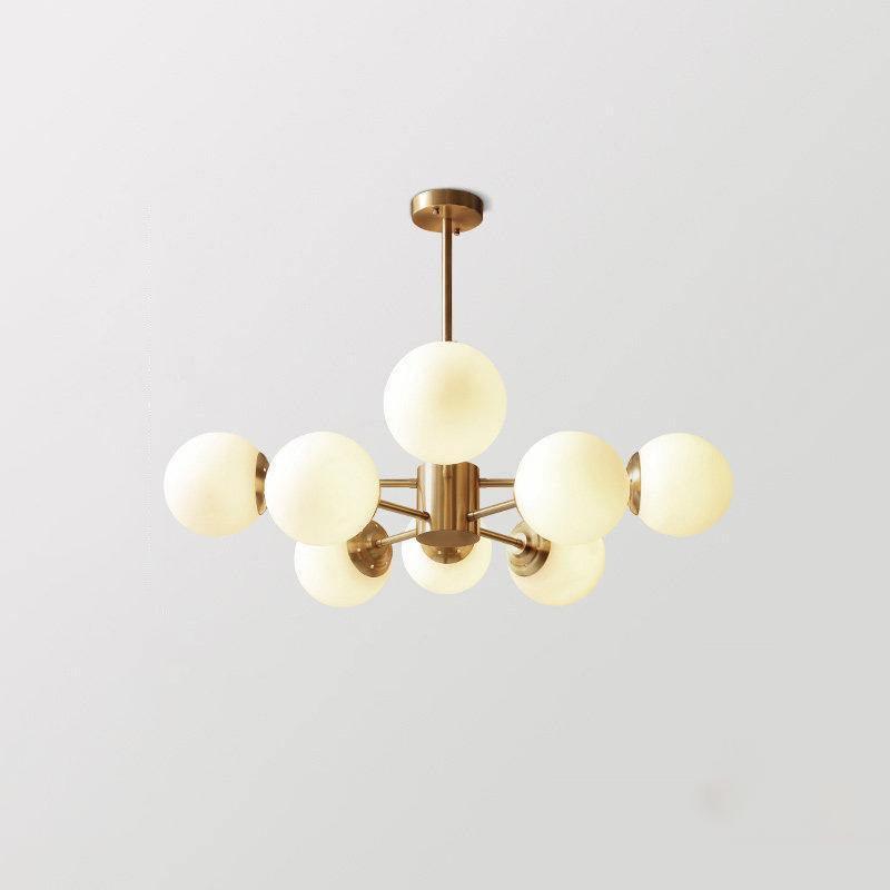 modern-asymmetrical-brass-chandelier-with-opal-glass-globe-shades-for-living-and-dining-rooms