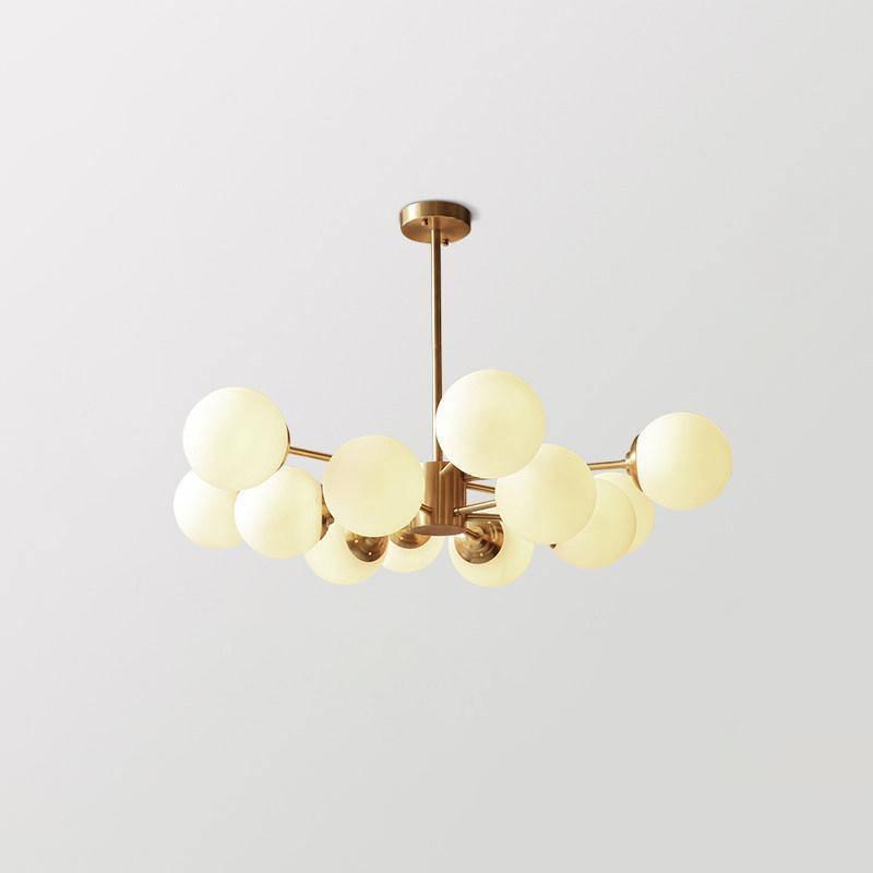modern-asymmetrical-brass-chandelier-with-opal-glass-globe-shades-for-living-and-dining-rooms