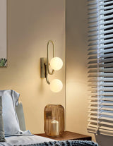 Modern Belisto Gold Wall Lamp with Oval Metal Frame and White Glass Globe Shade