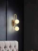 Modern Belisto Gold Wall Lamp with Oval Metal Frame and White Glass Globe Shade