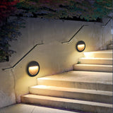 Modern Black Circular LED Outdoor Step Light and Exterior Wall Sconce for Patios and Stairways