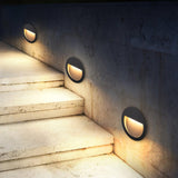 Modern Black Circular LED Outdoor Step Light and Exterior Wall Sconce for Patios and Stairways