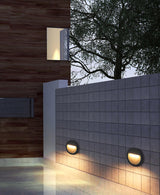 Modern Black Circular LED Outdoor Step Light and Exterior Wall Sconce for Patios and Stairways