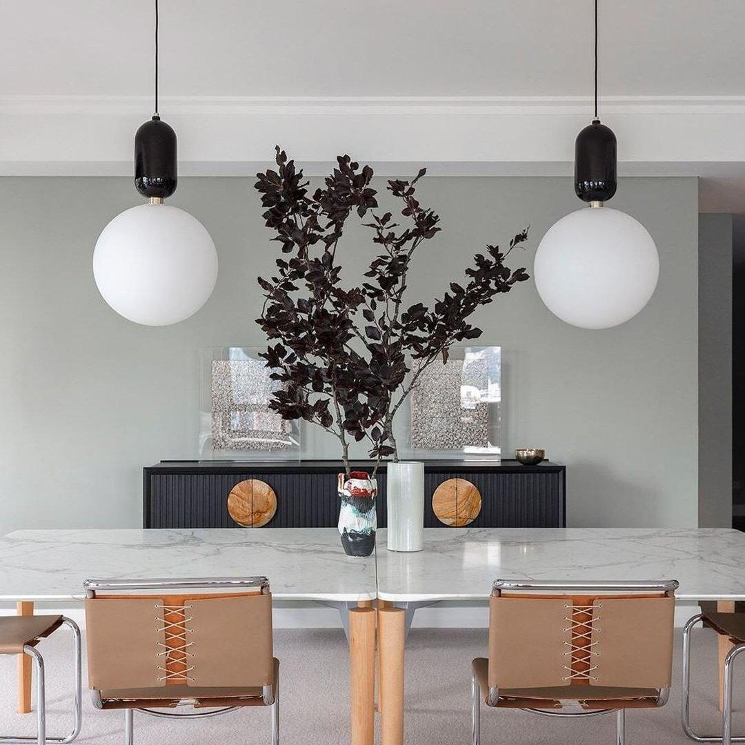 Modern Blown Glass Pendant Light with Minimalist Metal Frame for Contemporary Indoor Spaces