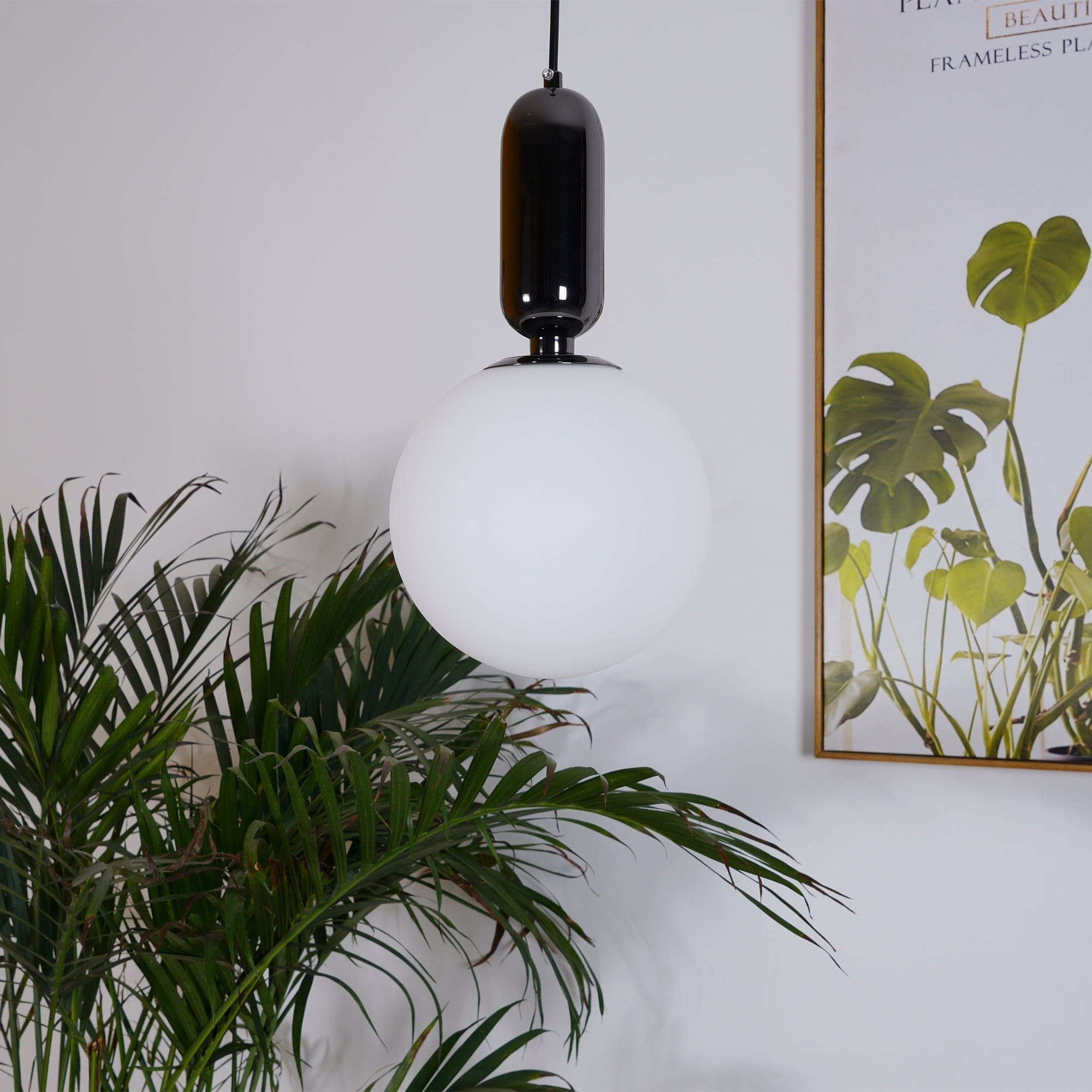 Modern Blown Glass Pendant Light with Minimalist Metal Frame for Contemporary Indoor Spaces