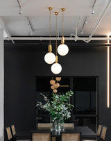 Modern Blown Glass Pendant Light with Minimalist Metal Frame for Contemporary Indoor Spaces
