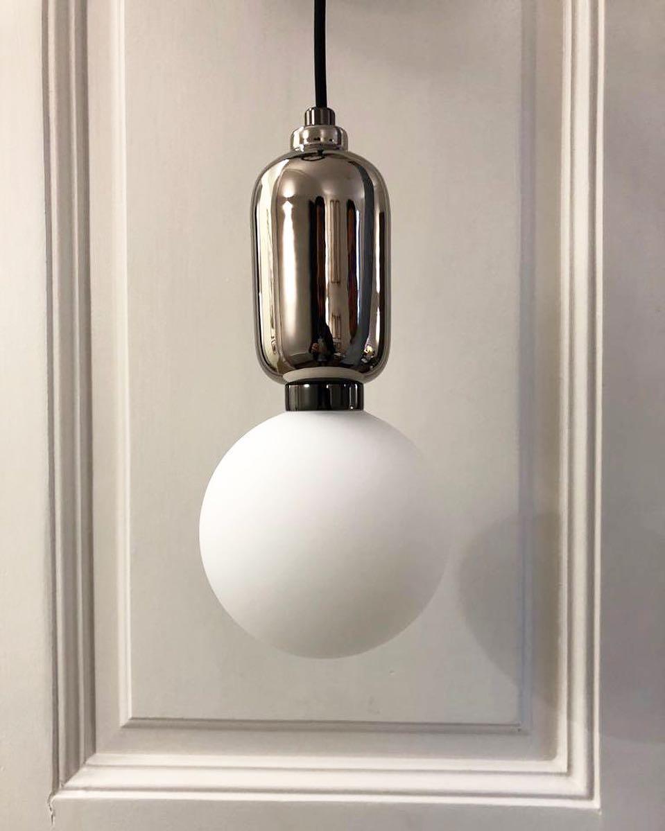 Modern Blown Glass Pendant Light with Minimalist Metal Frame for Contemporary Indoor Spaces