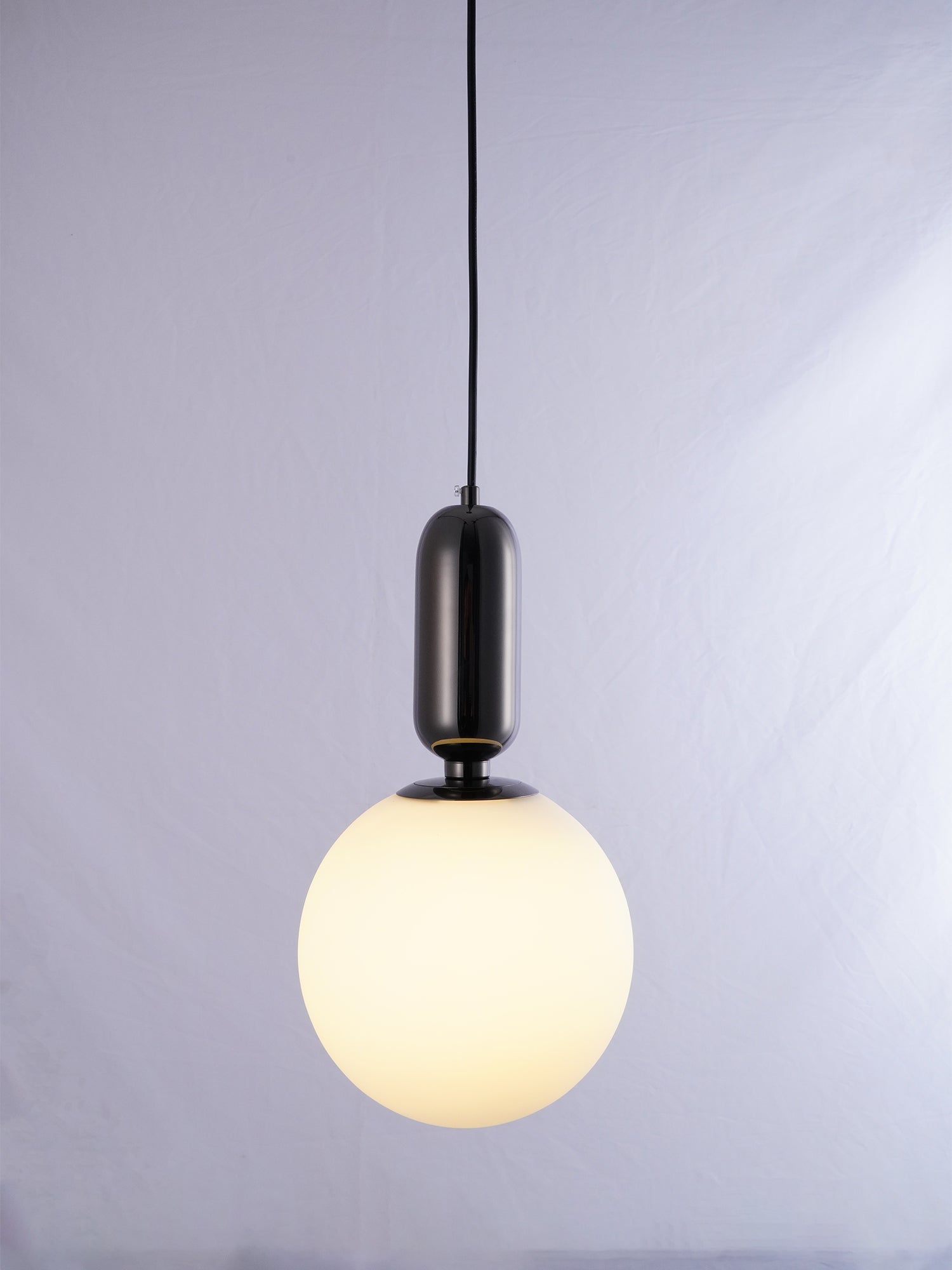 Modern Blown Glass Pendant Light with Minimalist Metal Frame for Contemporary Indoor Spaces