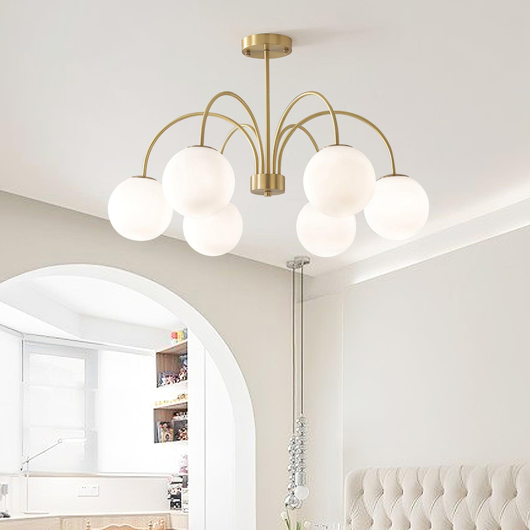 Modern Brass Globe Crown Chandelier with Elegant Curved Arms and Glass Ball Shades
