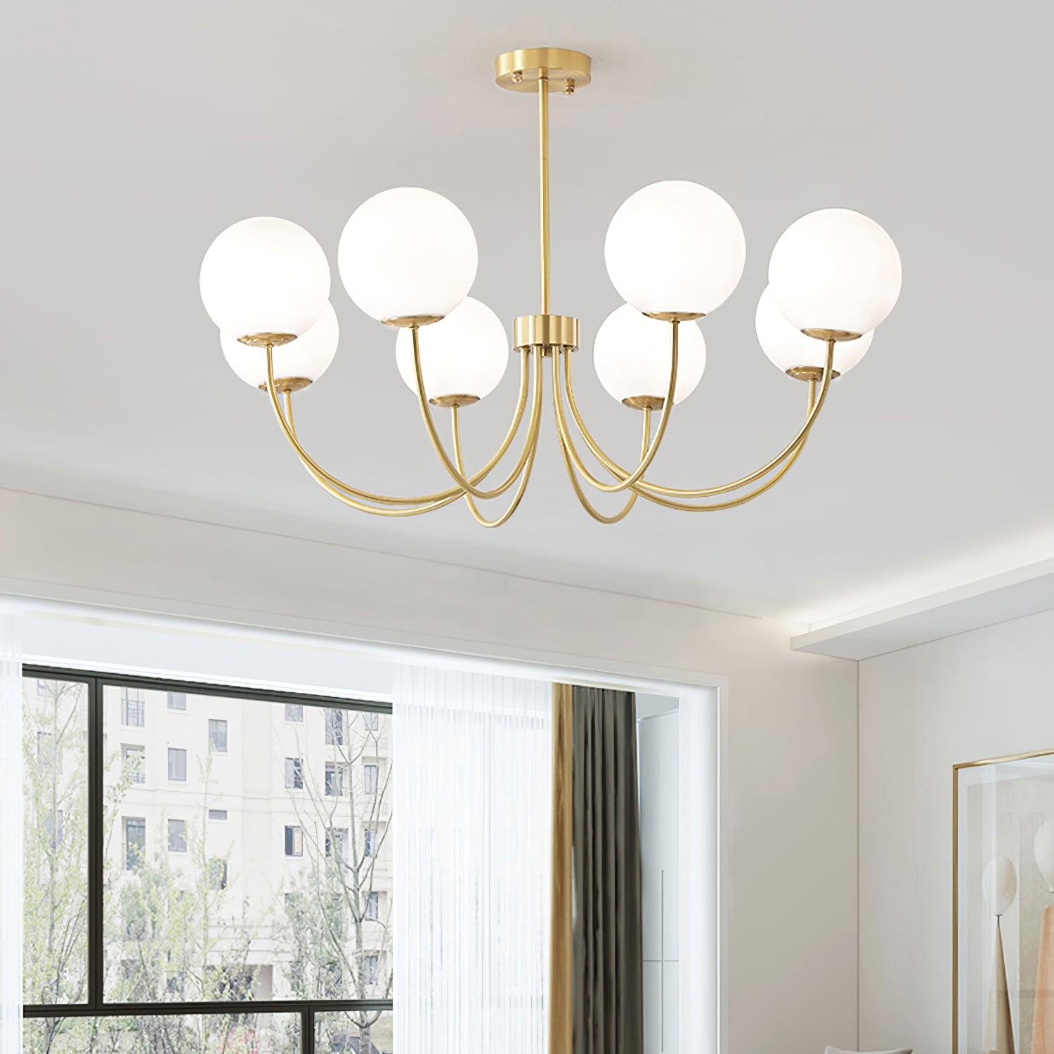 Modern Brass Globe Crown Chandelier with Elegant Curved Arms and Glass Ball Shades