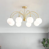 Modern Brass Globe Crown Chandelier with Elegant Curved Arms and Glass Ball Shades