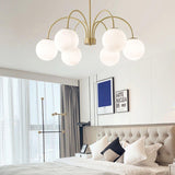 Modern Brass Globe Crown Chandelier with Elegant Curved Arms and Glass Ball Shades