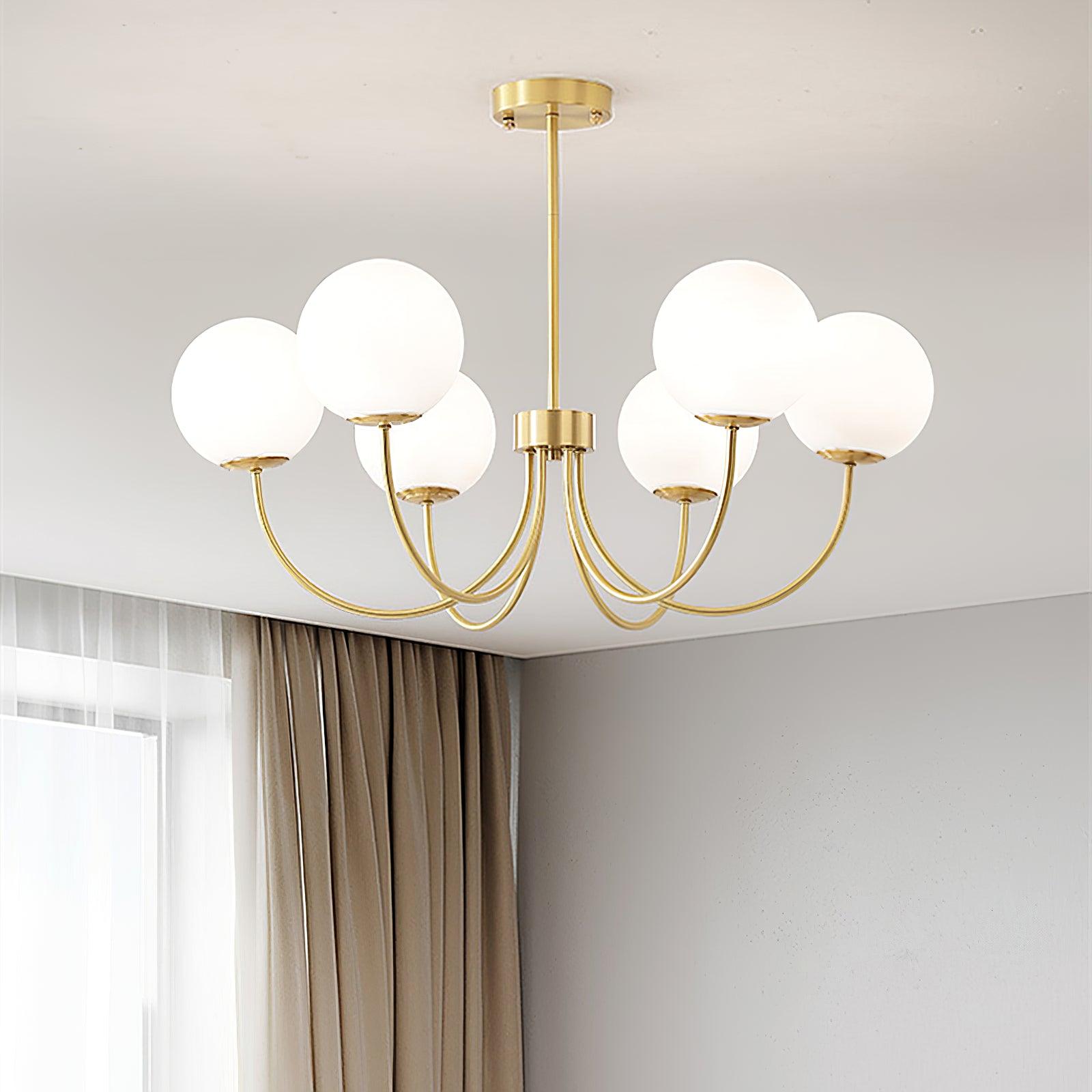 Modern Brass Globe Crown Chandelier with Elegant Curved Arms and Glass Ball Shades