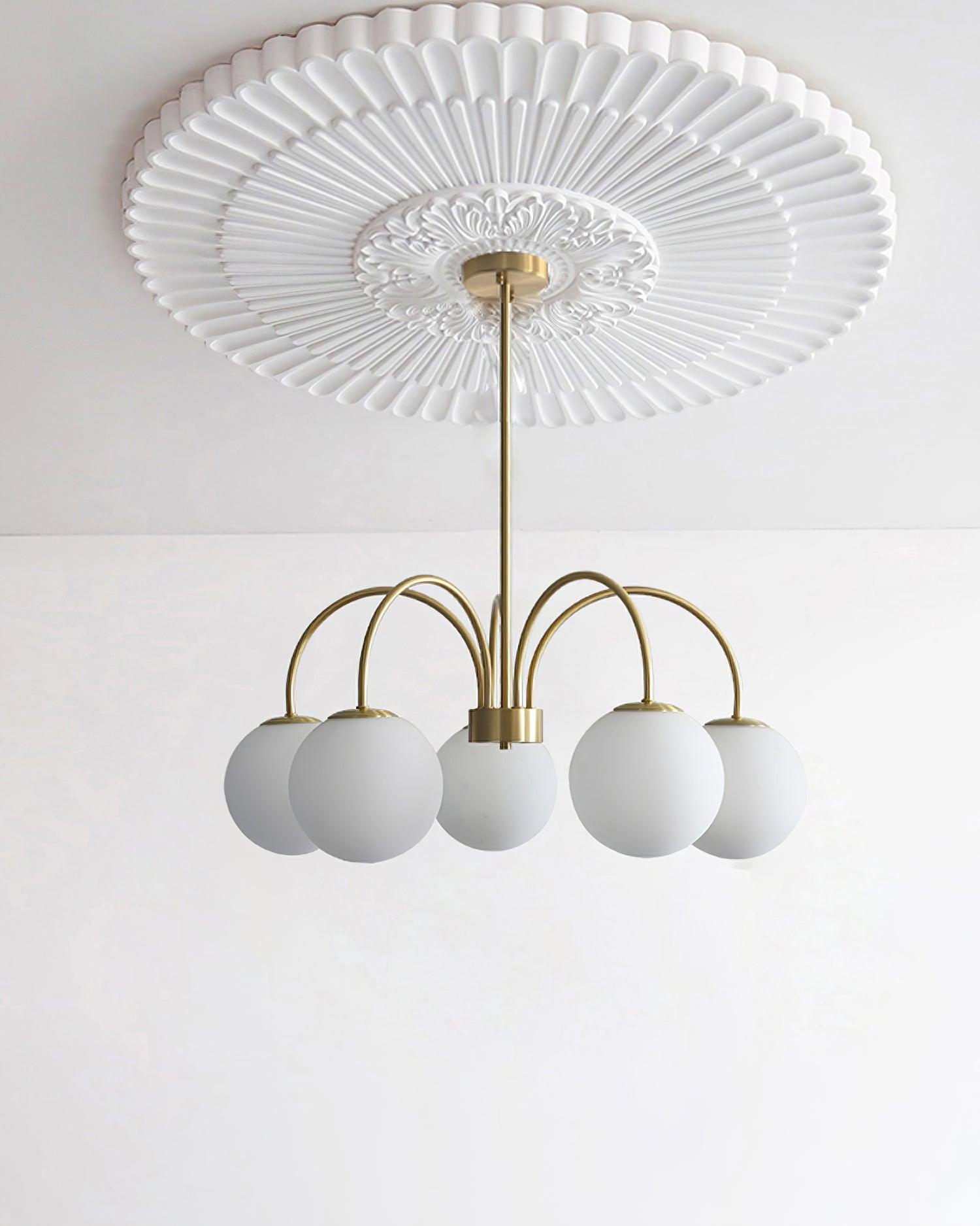 Modern Brass Globe Crown Chandelier with Elegant Curved Arms and Glass Ball Shades
